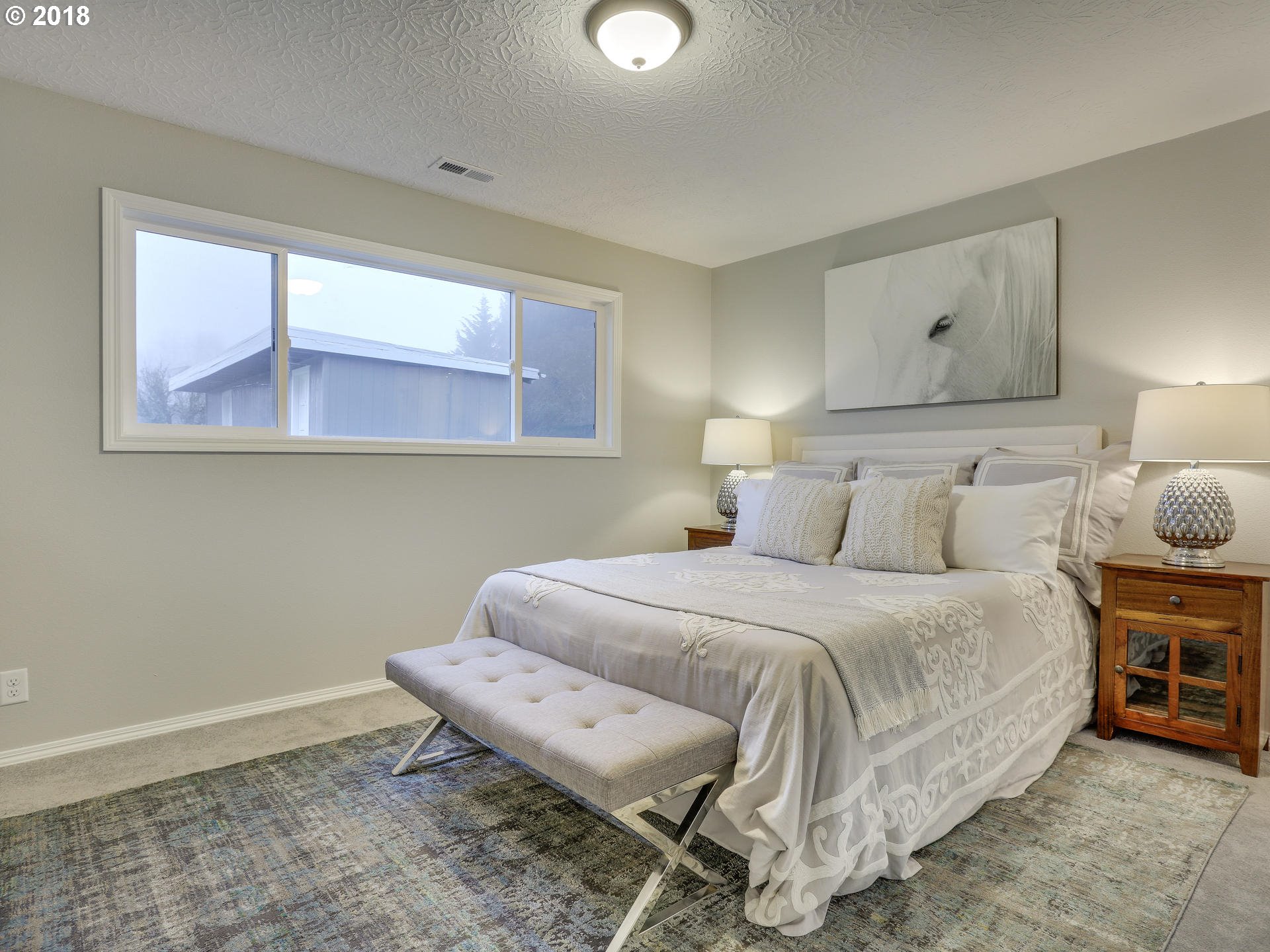 21130 Southeast Foster Road Damascus, OR 97089 - Photo 18 of 30 a bedroom with a bed and window