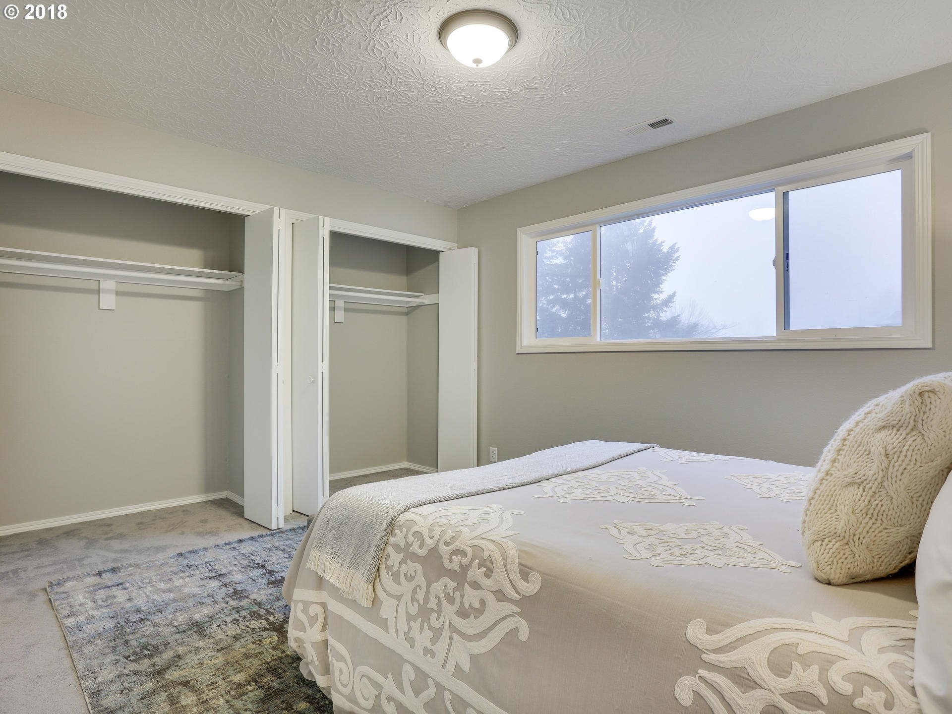 21130 Southeast Foster Road Damascus, OR 97089 - Photo 20 of 30 a bedroom with a bed and window