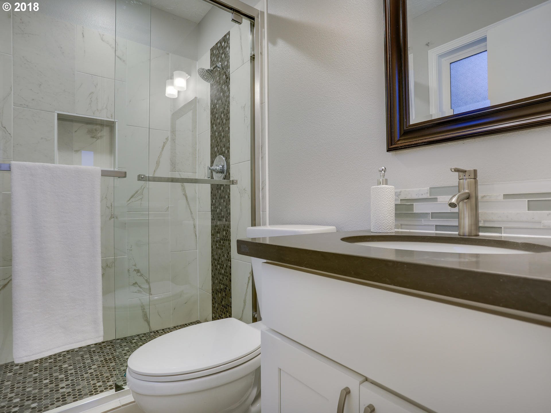 21130 Southeast Foster Road Damascus, OR 97089 - Photo 21 of 30 a bathroom with a sink a toilet and shower