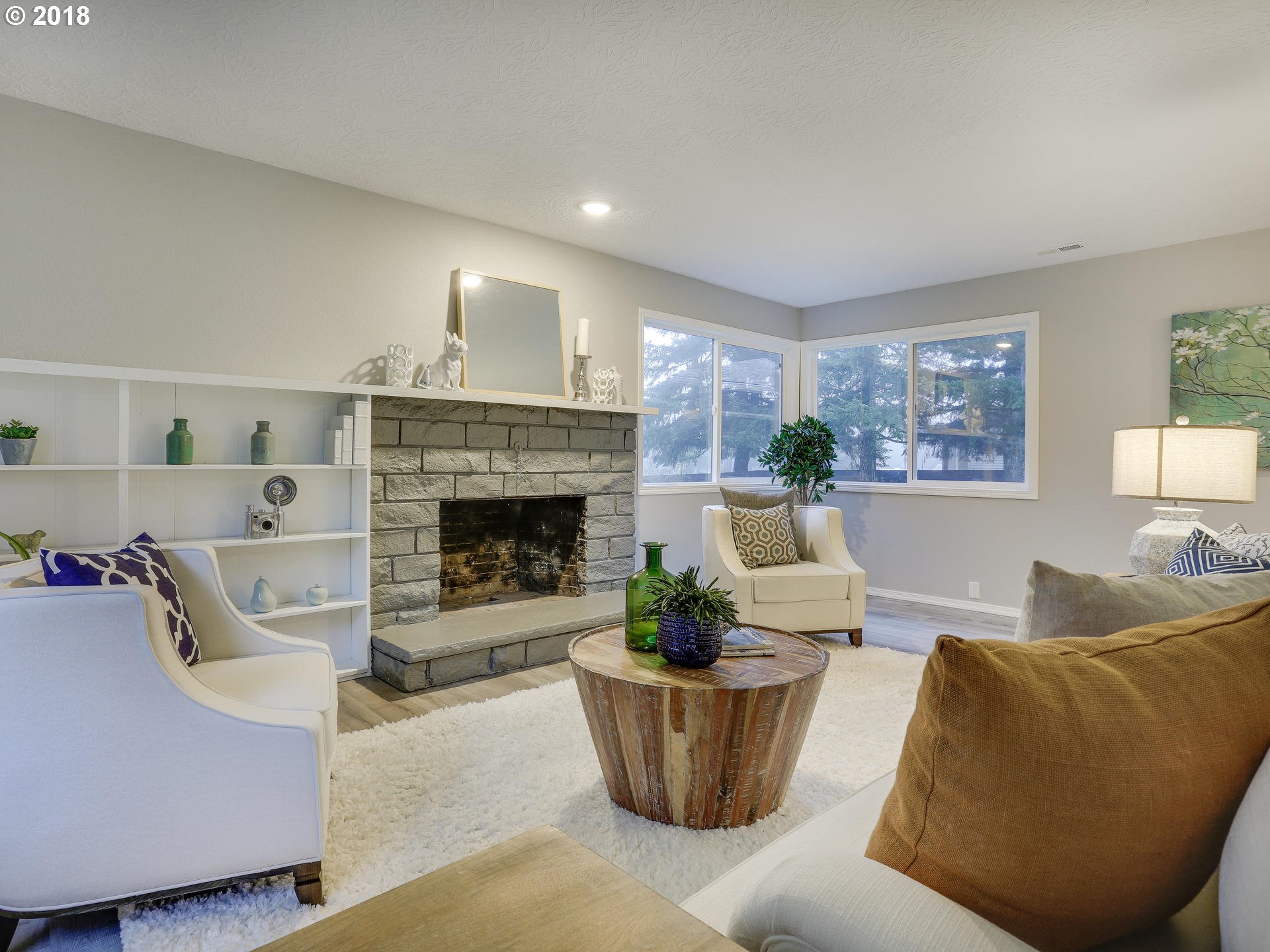 21130 Southeast Foster Road Damascus, OR 97089 - Photo 6 of 30 a living room with furniture and a fireplace