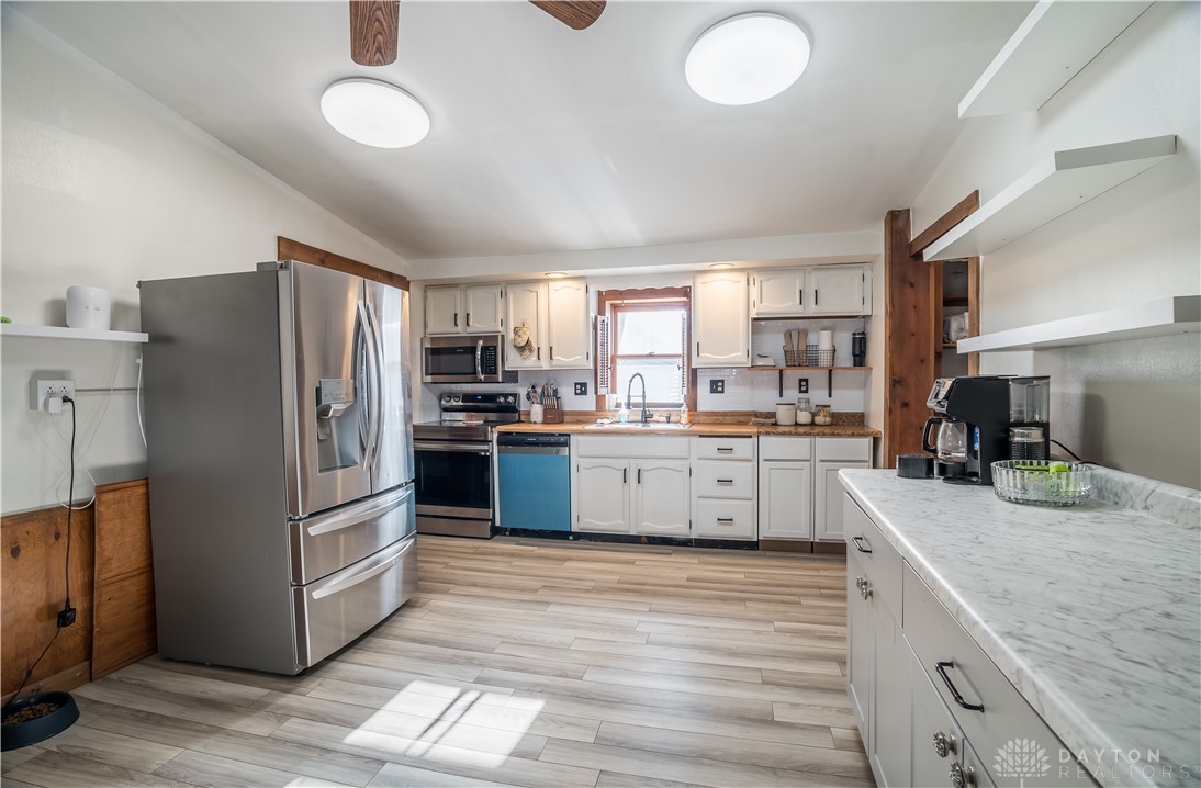 220 Racer Street Troy, OH 45373 - Photo 15 of 33 This spacious kitchen offers ample counter space and modern appliances, perfect for everyday living.