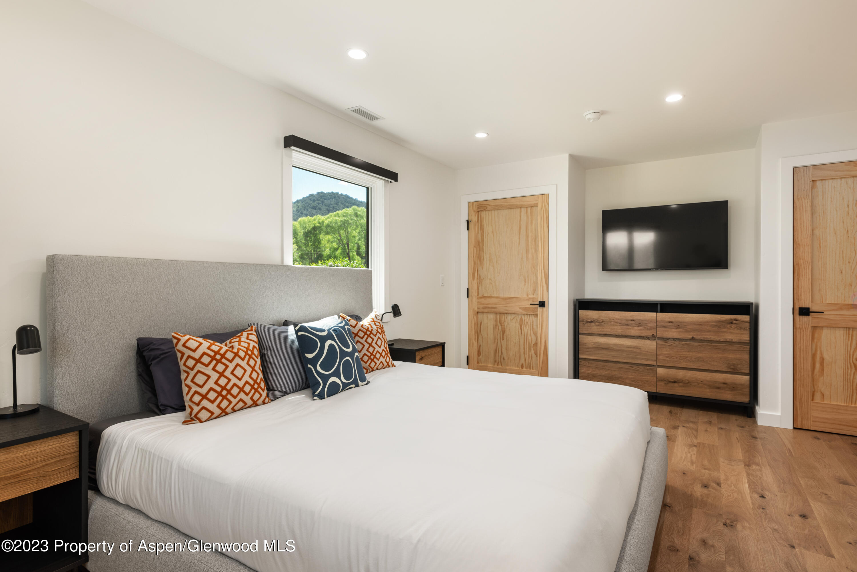 210 Horseshoe Drive Basalt, CO 81621 - Photo 22 of 52 a bedroom with a bed and a flat screen tv