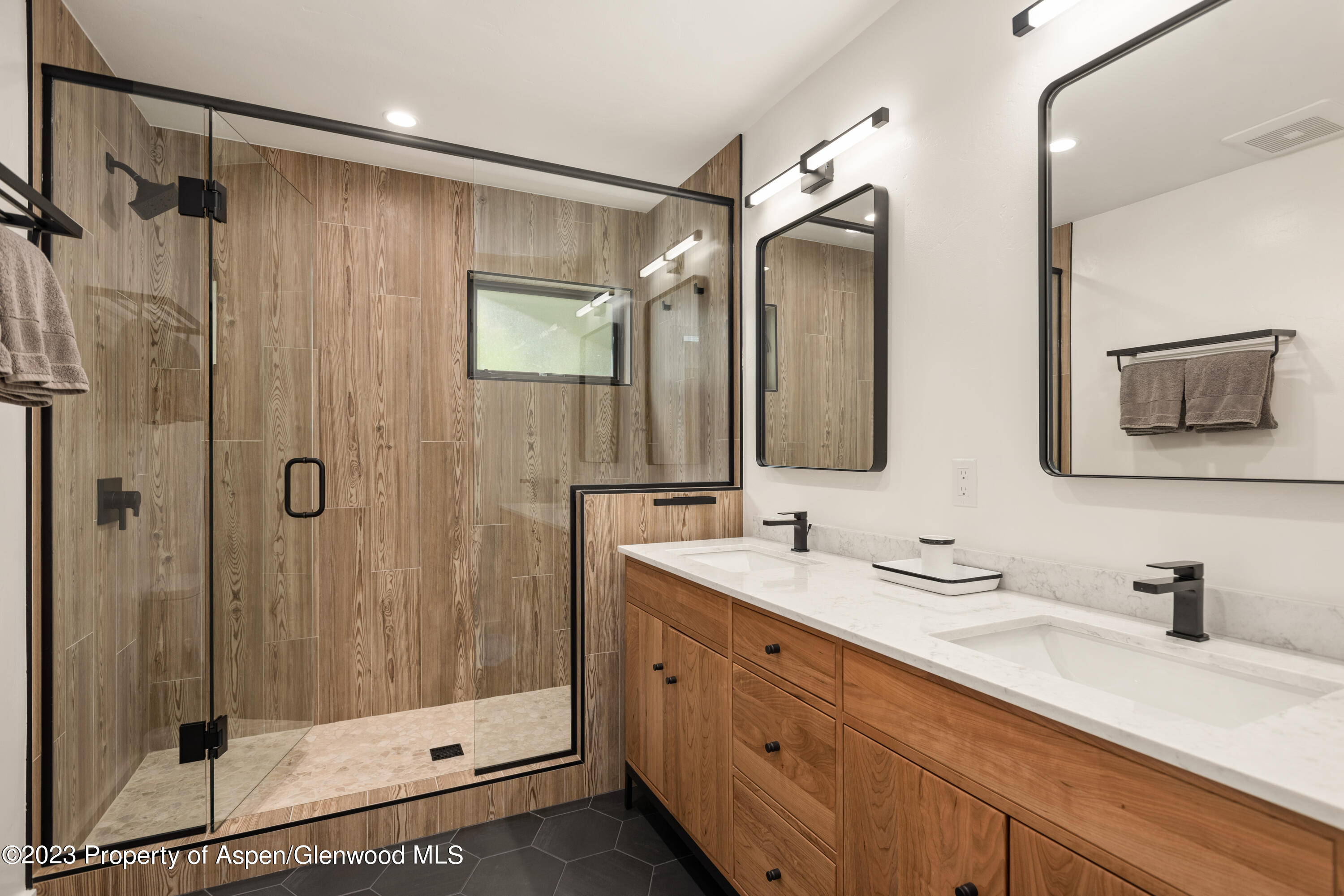 210 Horseshoe Drive Basalt, CO 81621 - Photo 26 of 52 a bathroom with a double vanity sink mirror and shower