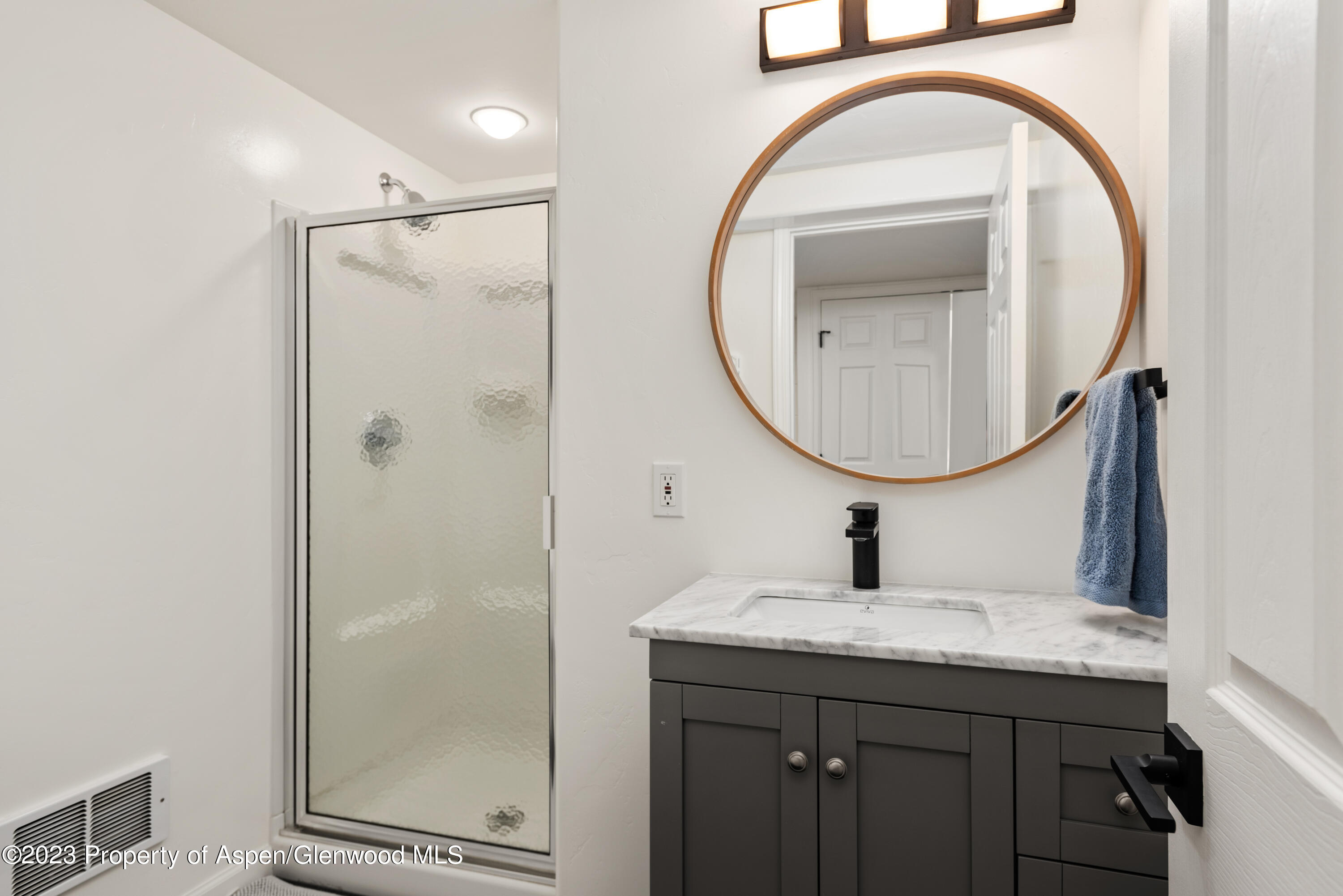 210 Horseshoe Drive Basalt, CO 81621 - Photo 31 of 52 a bathroom with a sink a vanity and a mirror