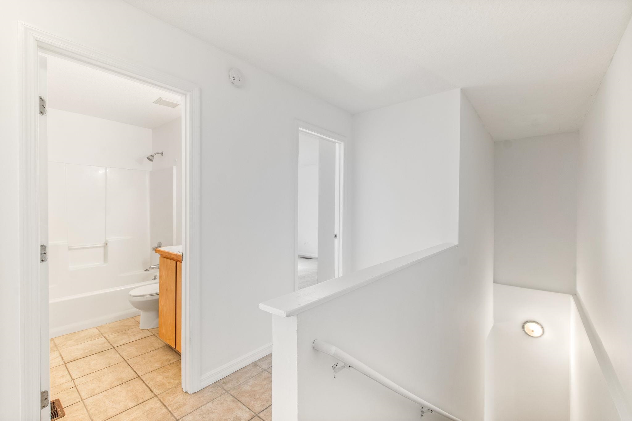 202 F Street St. Augustine, FL 32080 - Photo 16 of 28 a bathroom with a tub and shower