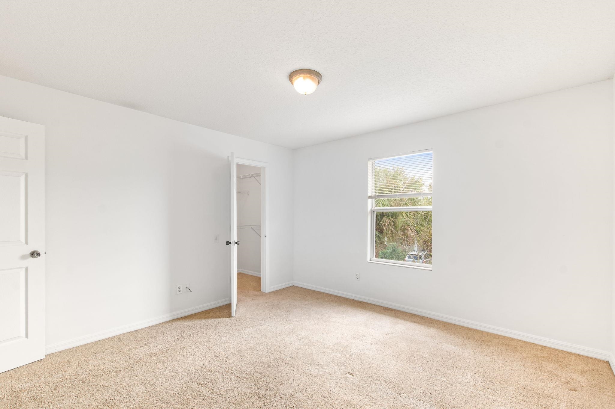 202 F Street St. Augustine, FL 32080 - Photo 20 of 28 a view of an empty room with a window