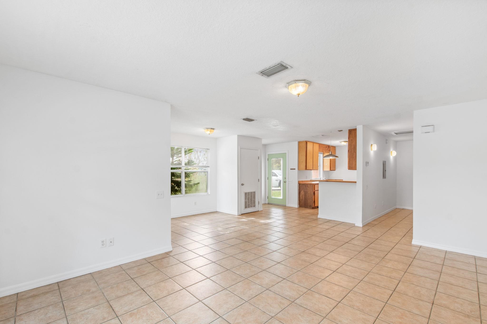 202 F Street St. Augustine, FL 32080 - Photo 9 of 28 a view of a kitchen with furniture and an empty room