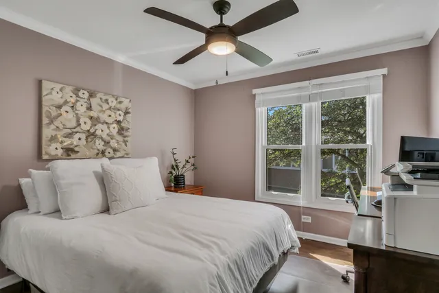 a bedroom with a large bed and a flat screen tv