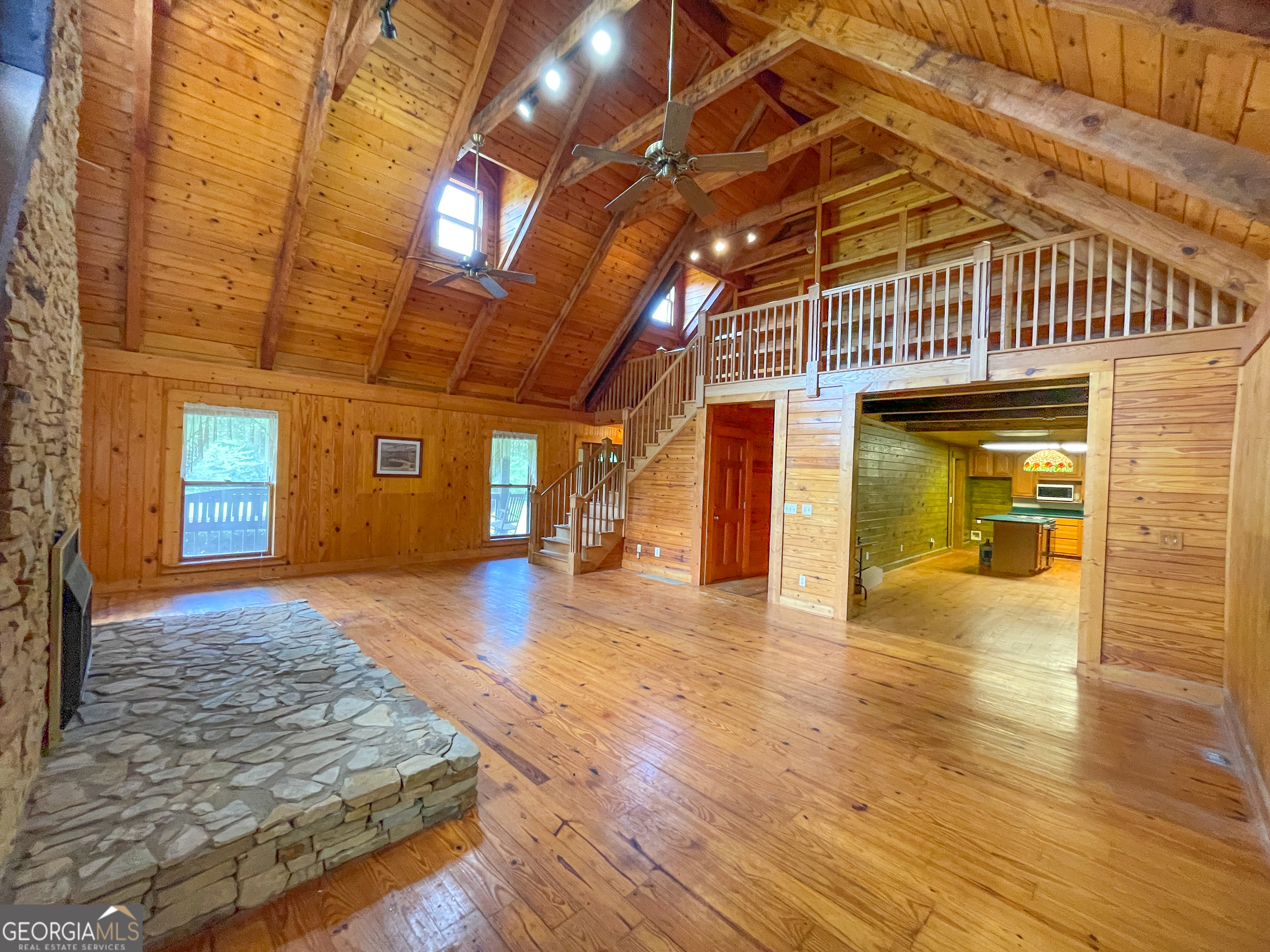 305 West Drive Roopville, GA 30170 - Photo 17 of 70 a view of livingroom with an empty space and wooden floor