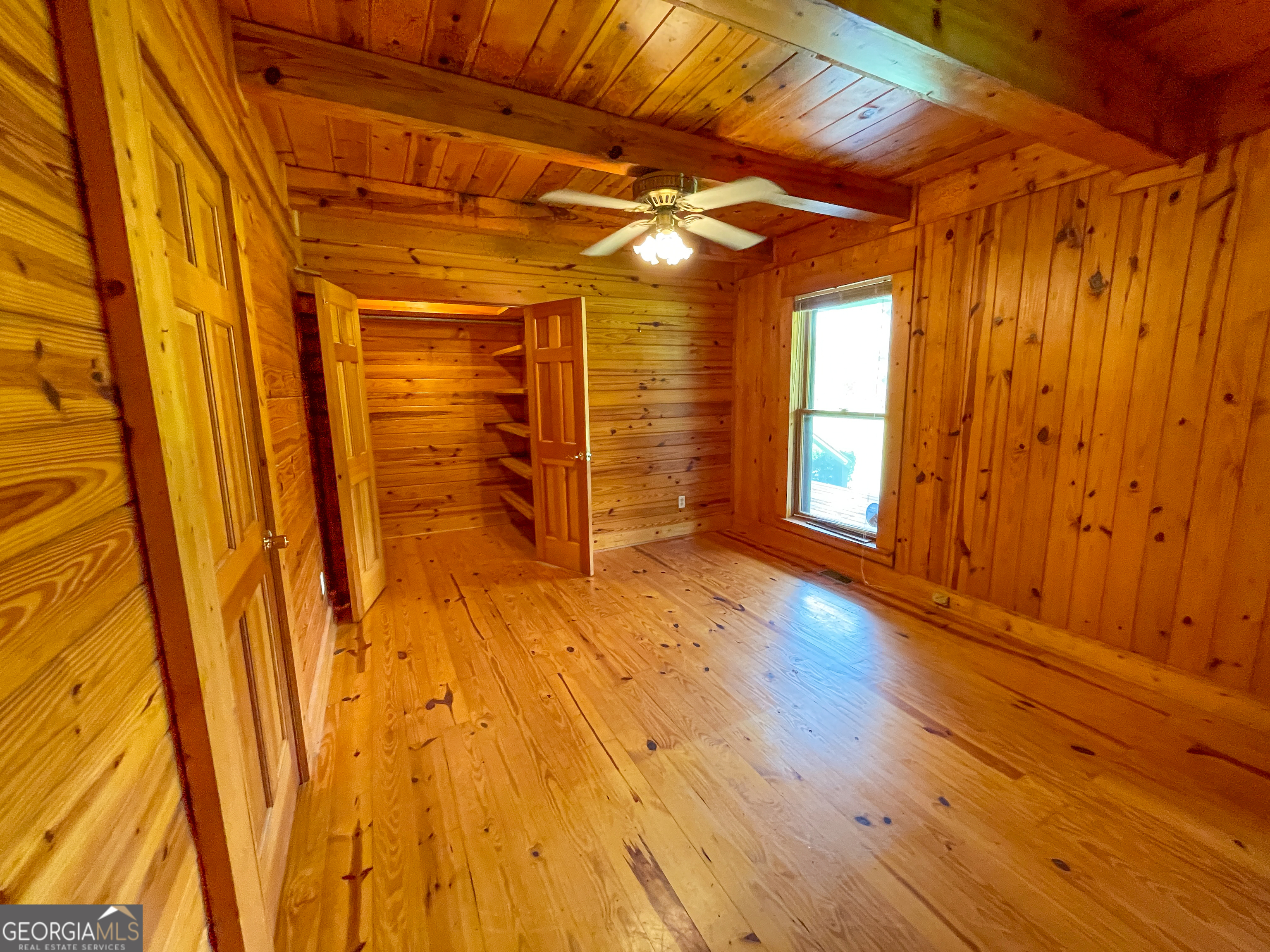 305 West Drive Roopville, GA 30170 - Photo 36 of 70 a view of an empty room with wooden floor and a window