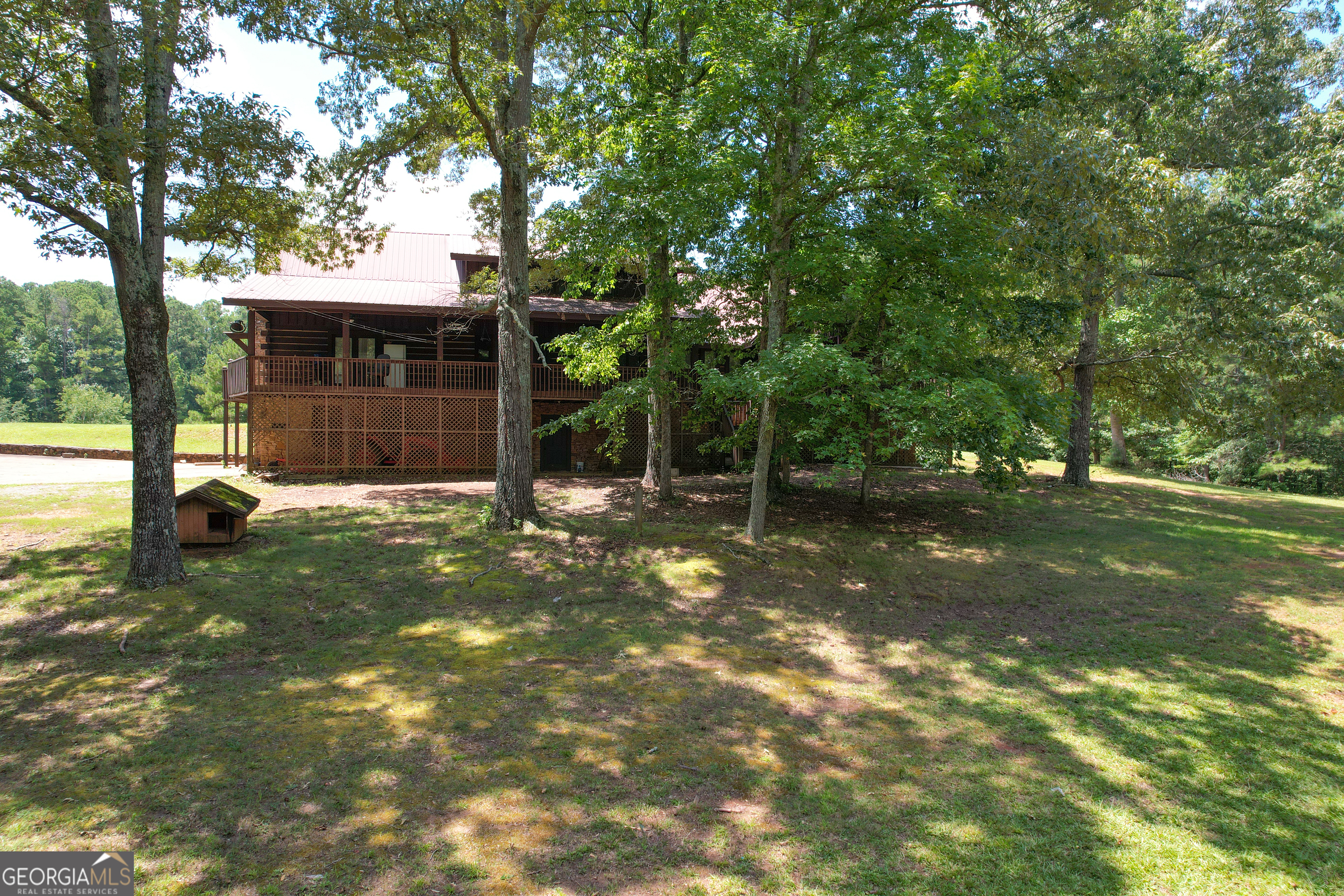 305 West Drive Roopville, GA 30170 - Photo 58 of 70 a backyard of a house with lots of green space