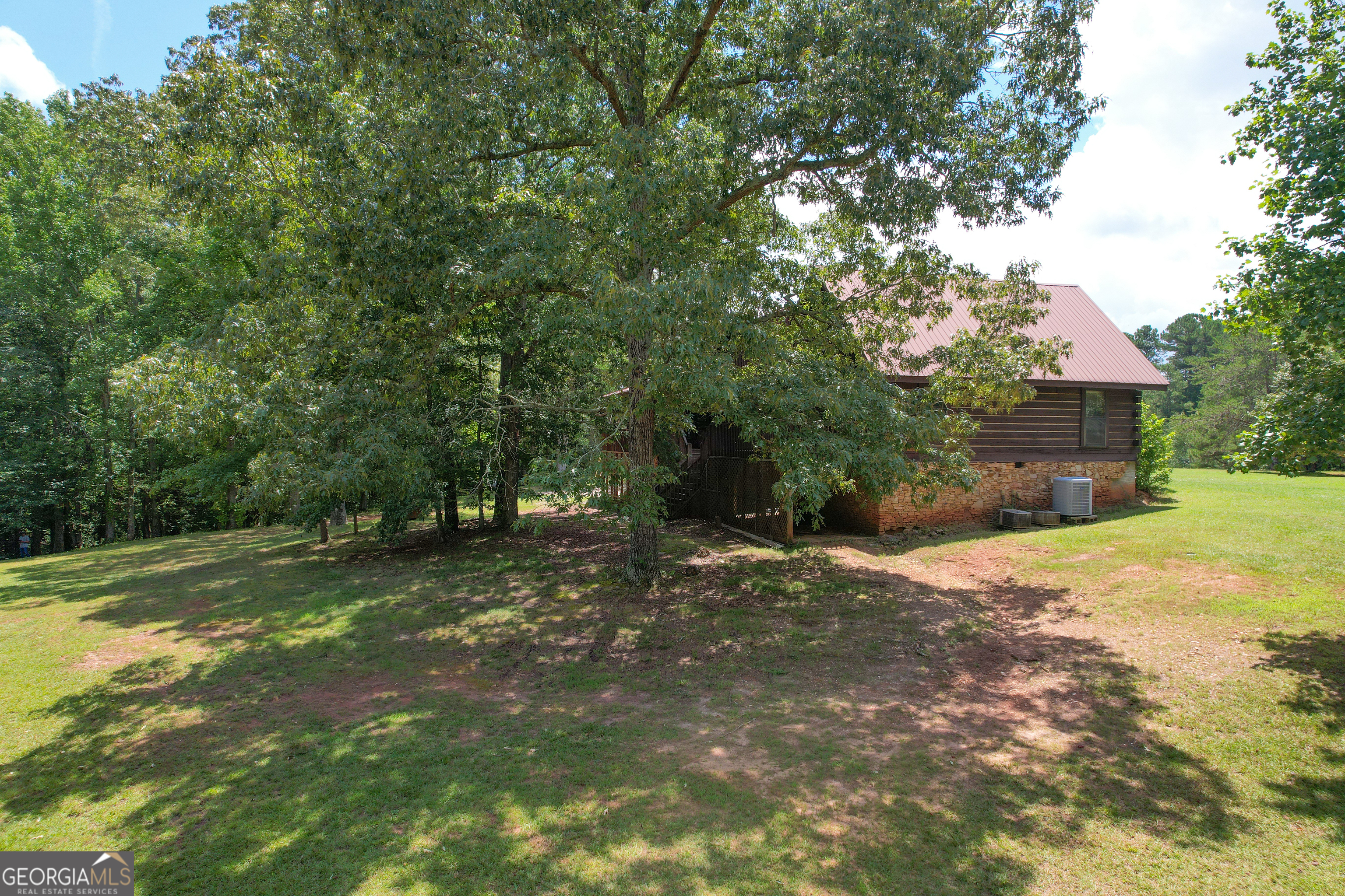305 West Drive Roopville, GA 30170 - Photo 65 of 70 a view of a yard with a tree