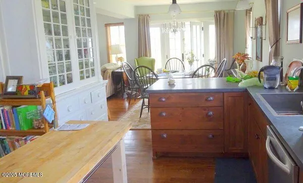 a room with a sink and a potted plant