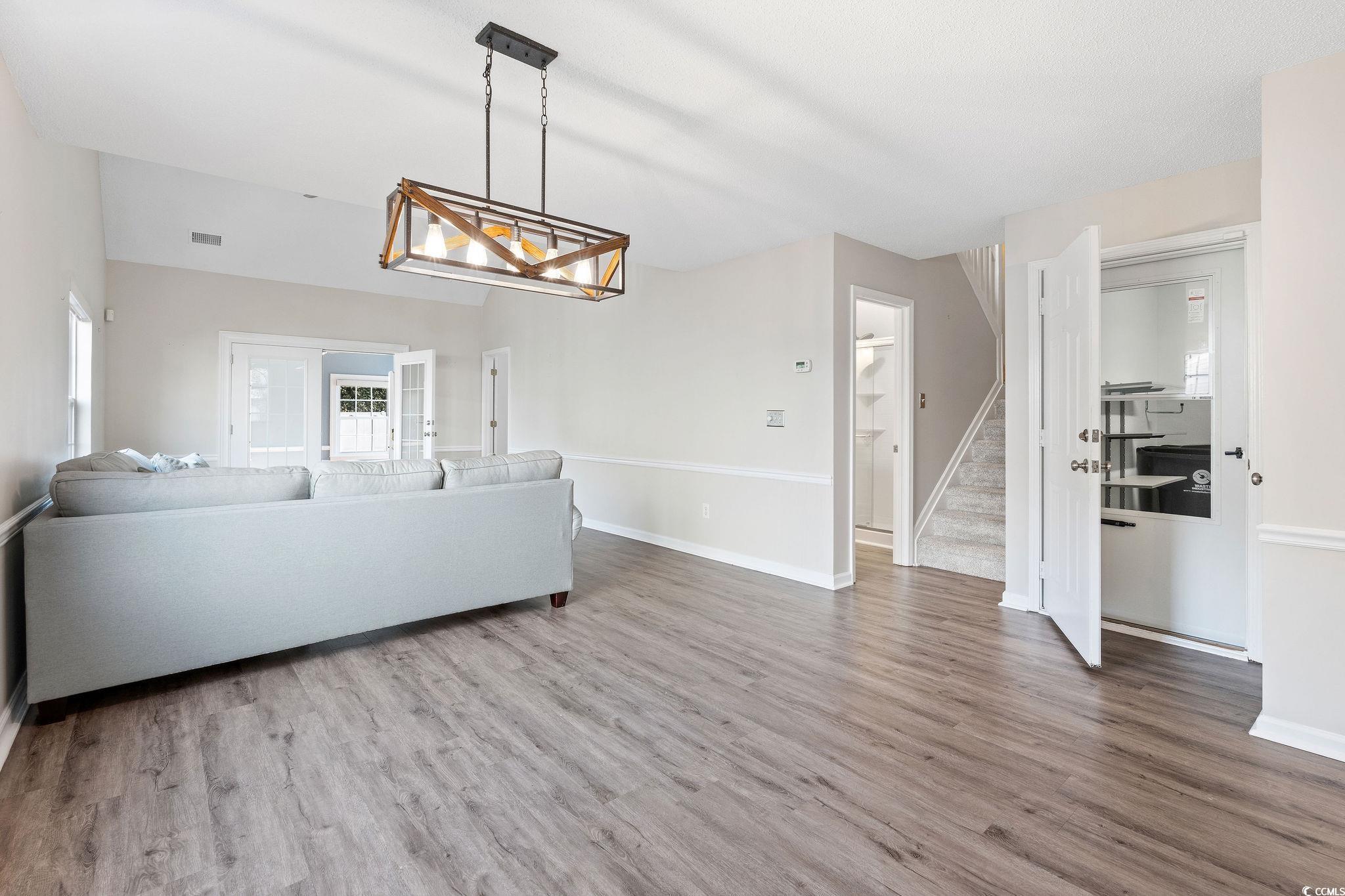 140 Wimbledon Way, Unit 140 Murrells Inlet, SC 29576 - Photo 6 of 24 Living room featuring hardwood / wood-style floors