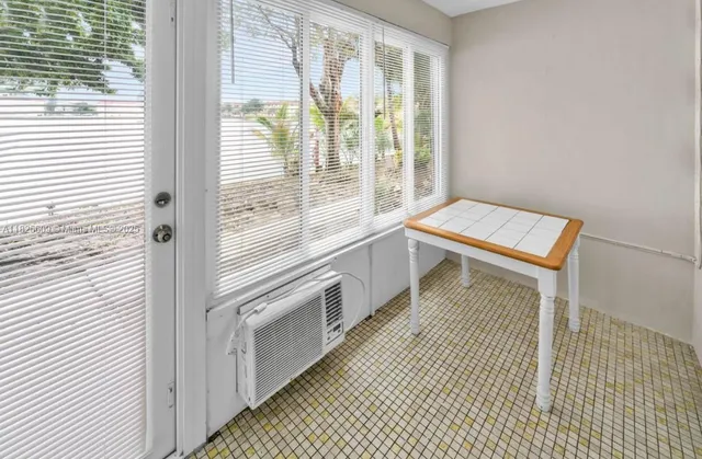 a view of a kitchen with a window