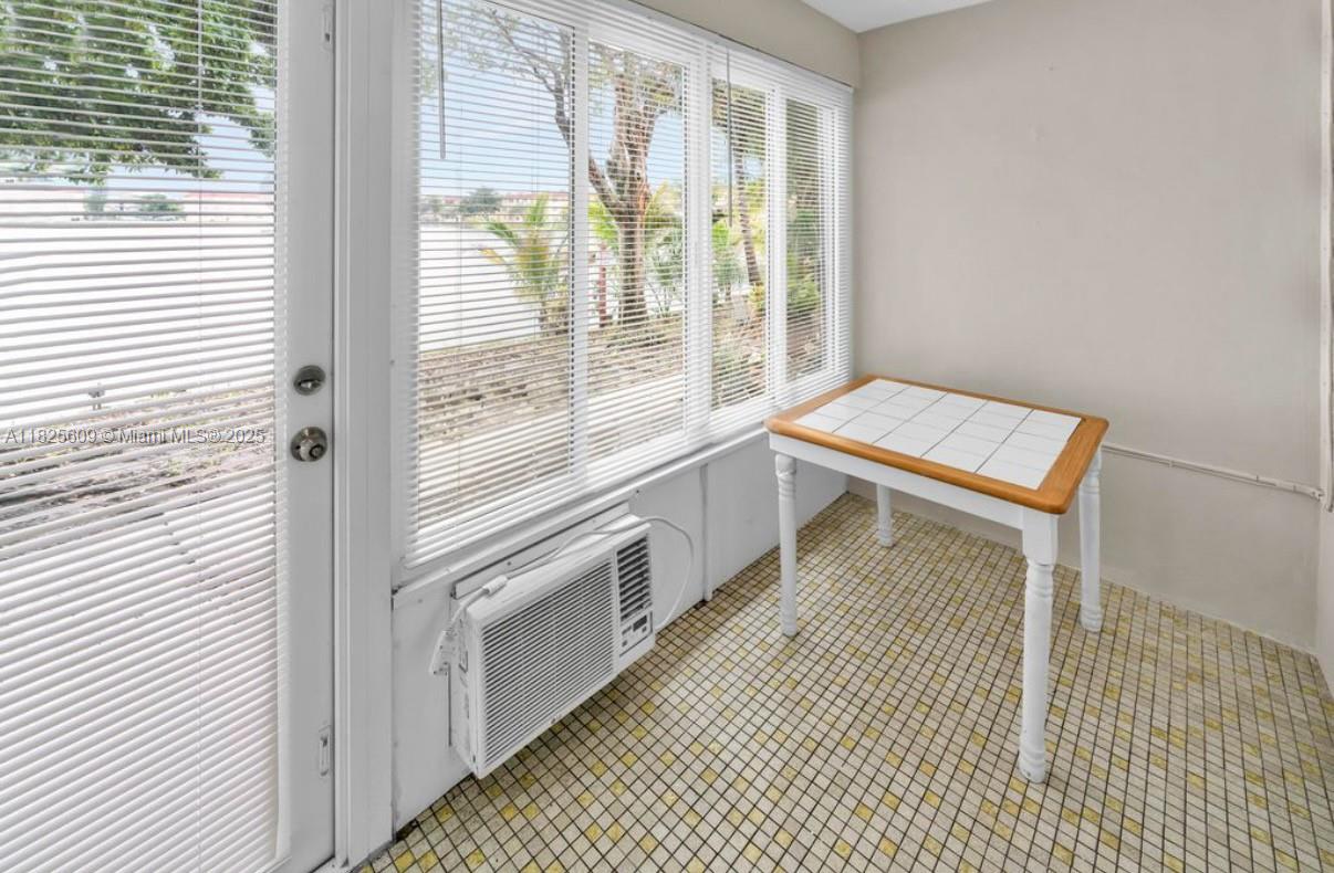 18801 Northeast 2nd Avenue, Unit 1006 Miami, FL 33179 - Photo 2 of 8 a view of a kitchen with a window