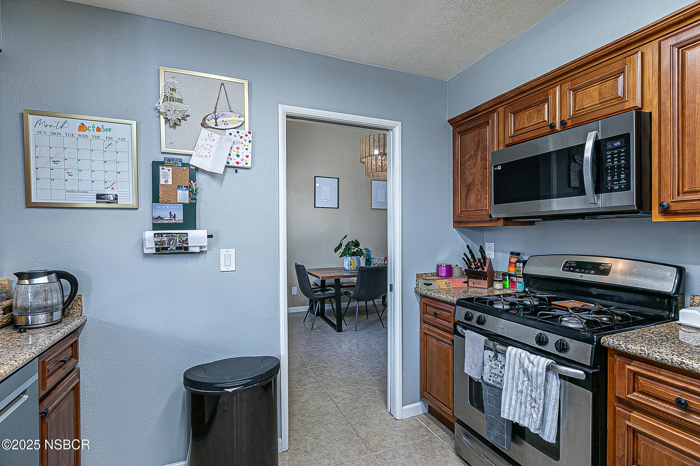 1320 Marigold Way Lompoc, CA 93436 - Photo 12 of 42 a kitchen with stainless steel appliances a stove a microwave and cabinets