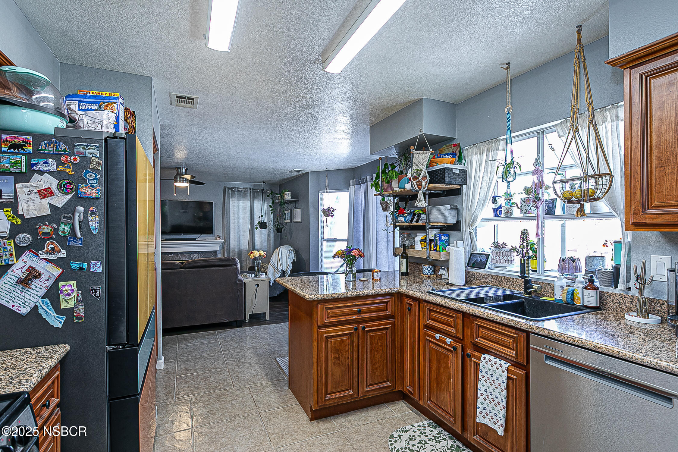 1320 Marigold Way Lompoc, CA 93436 - Photo 13 of 42 a kitchen with a sink refrigerator and window