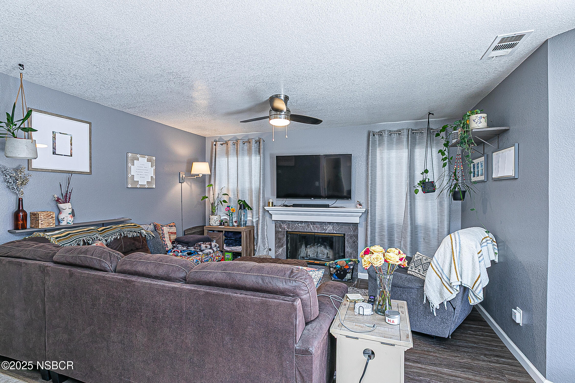 1320 Marigold Way Lompoc, CA 93436 - Photo 14 of 42 a living room with furniture flat screen tv and fireplace