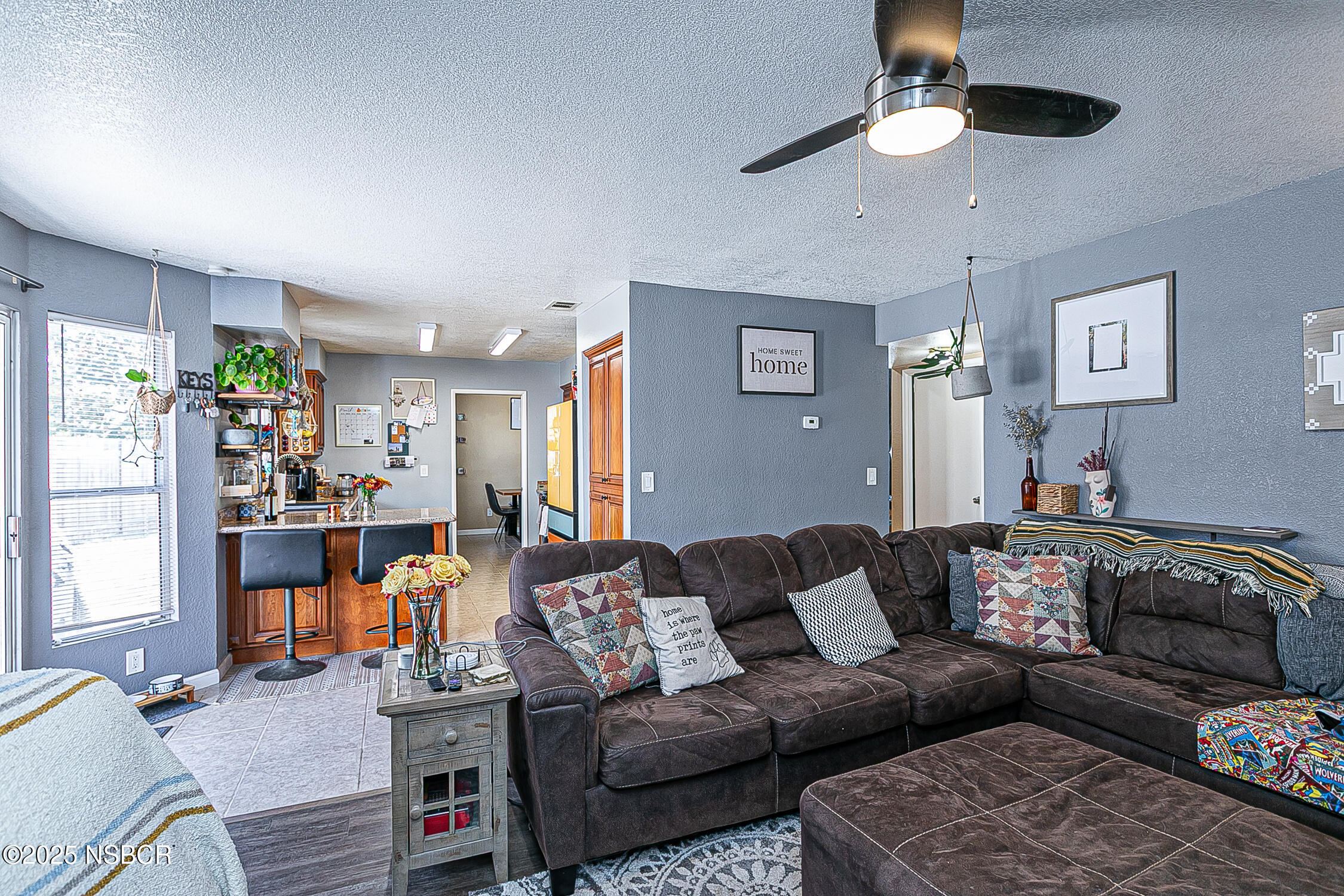 1320 Marigold Way Lompoc, CA 93436 - Photo 16 of 42 a living room with furniture or couch and a chandelier
