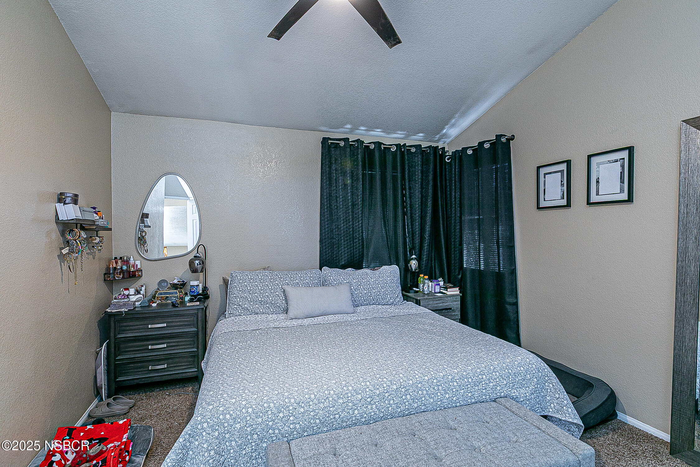 1320 Marigold Way Lompoc, CA 93436 - Photo 19 of 42 a bedroom with a bed a dresser and potted plants