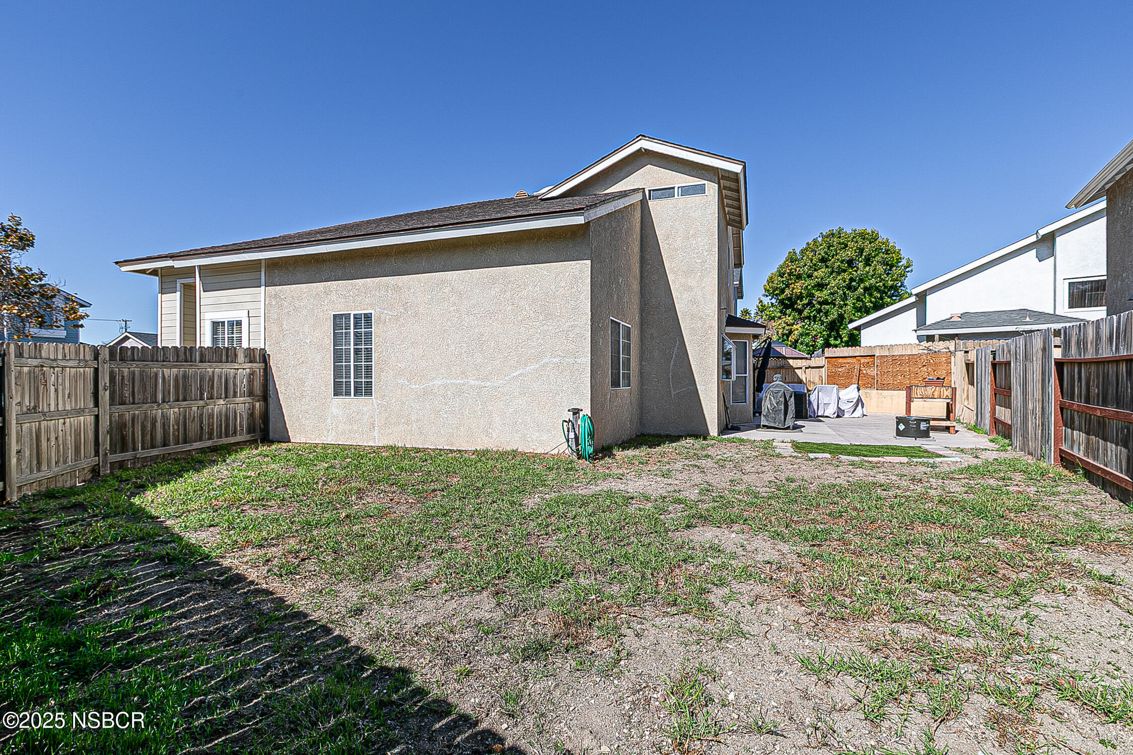 1320 Marigold Way Lompoc, CA 93436 - Photo 30 of 42 a house with green field in front of it