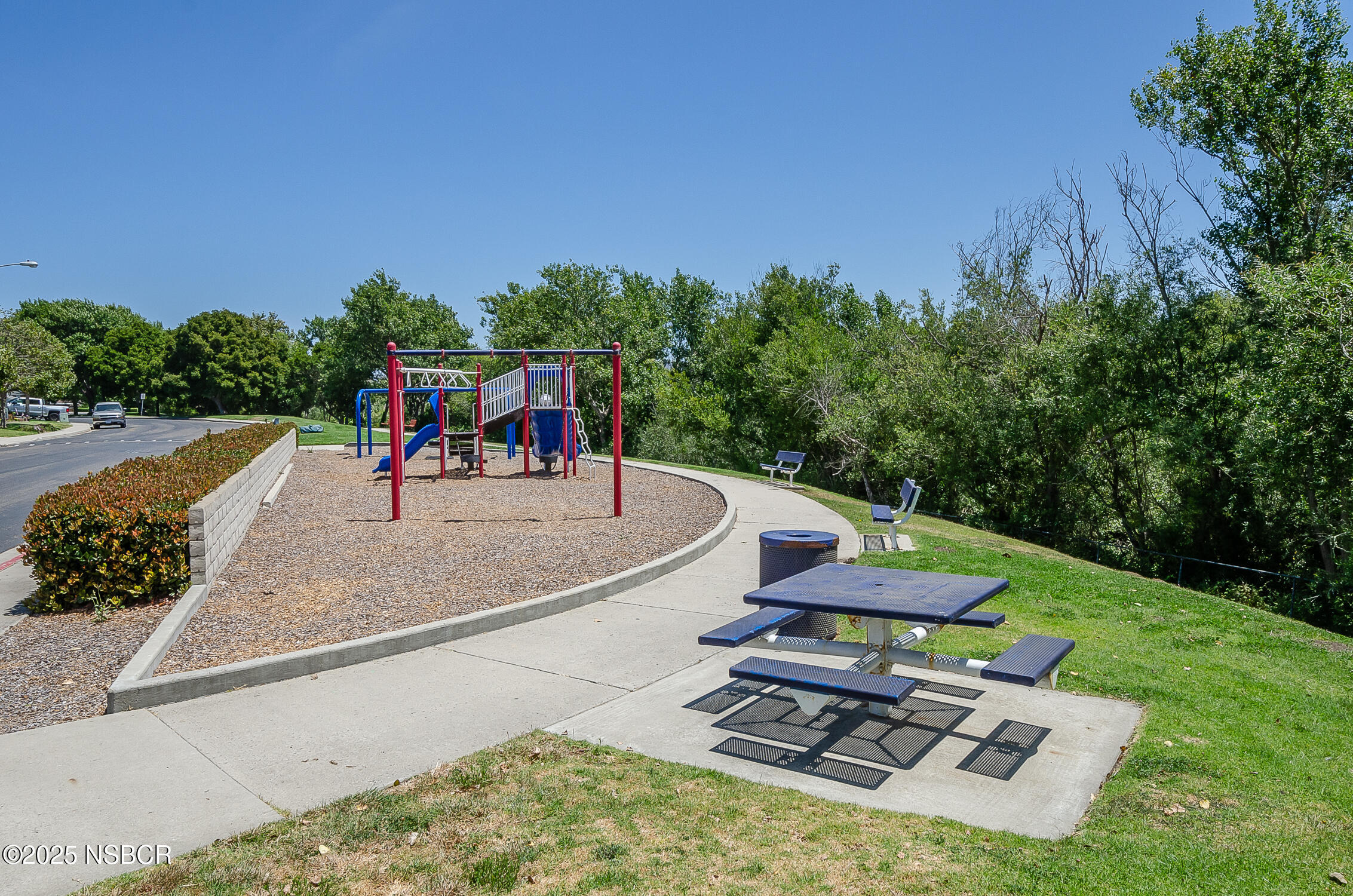 1320 Marigold Way Lompoc, CA 93436 - Photo 35 of 42 a view of a swimming pool with lawn chairs under an umbrella