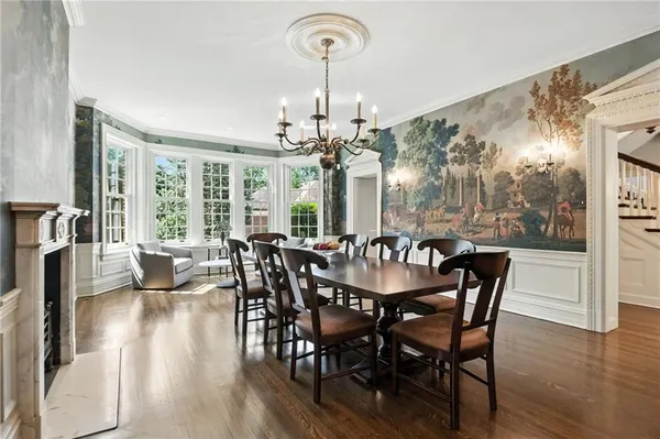a view of a dining room with furniture window and wooden floor