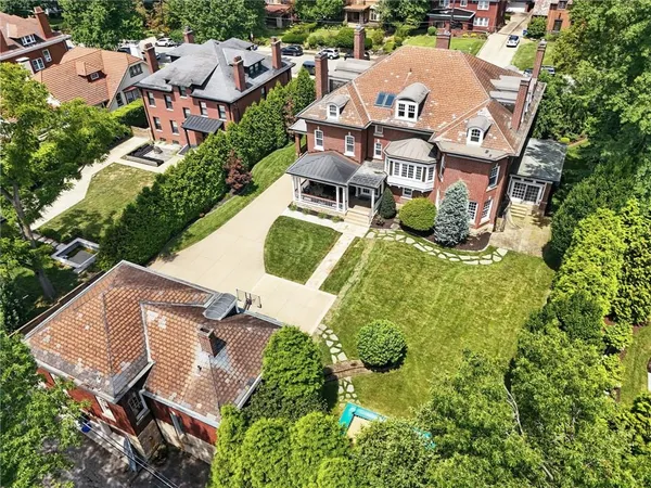 an aerial view of a house with a garden