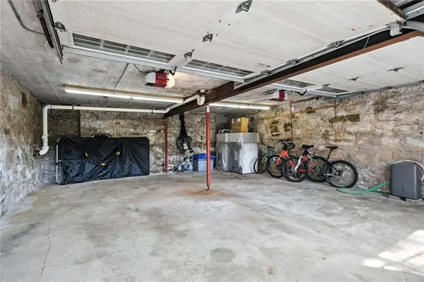 a view of a garage with rack and bicycle