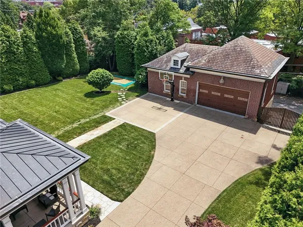 a view of a backyard with sitting area