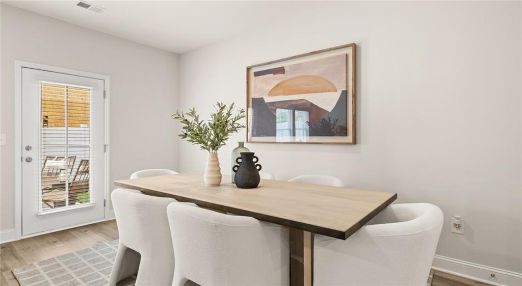 100 Rosemoore Drive Covington, GA 30014 - Photo 6 of 41 a dining room with table and chair