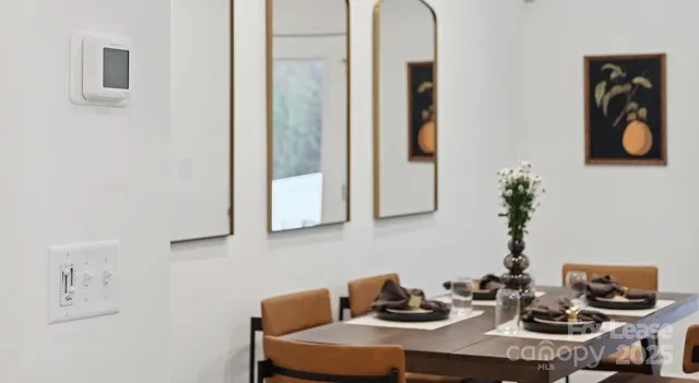 a table with a vase and flowers on it