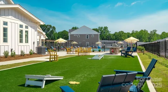 a front view of house with a garden and patio