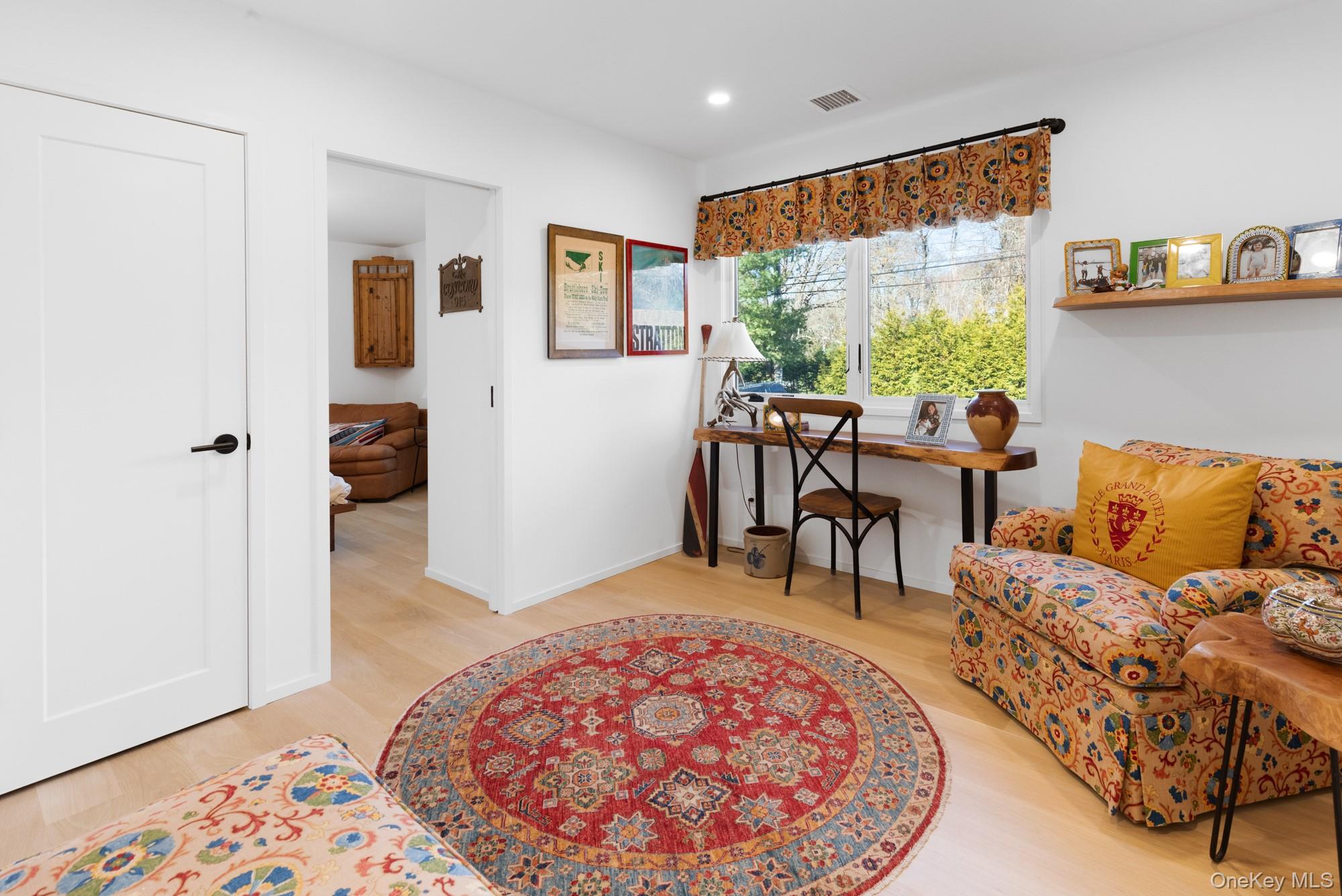 238 Sebonac Road Southampton, NY 11968 - Photo 12 of 23 a living room with furniture and a large window
