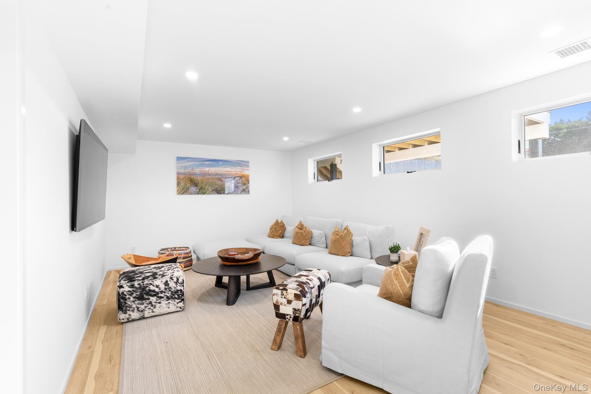 238 Sebonac Road Southampton, NY 11968 - Photo 16 of 23 a living room with furniture and a wooden floor