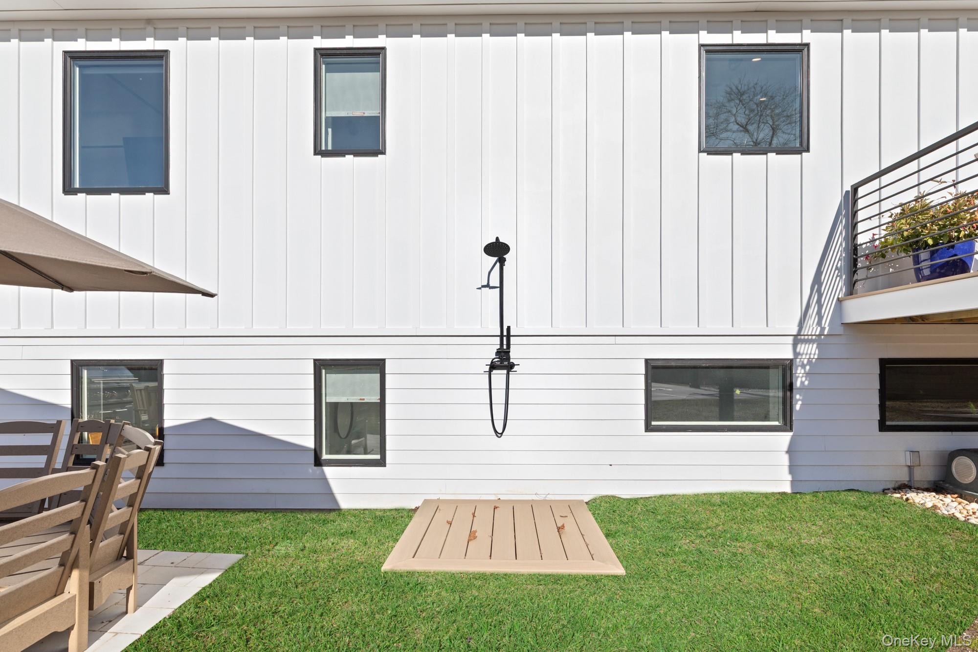 238 Sebonac Road Southampton, NY 11968 - Photo 20 of 23 a front view of a house with garden