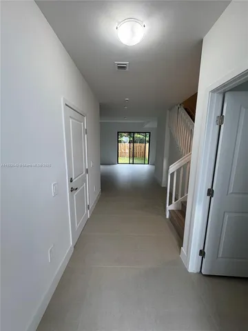 a view of entryway and hall with a window