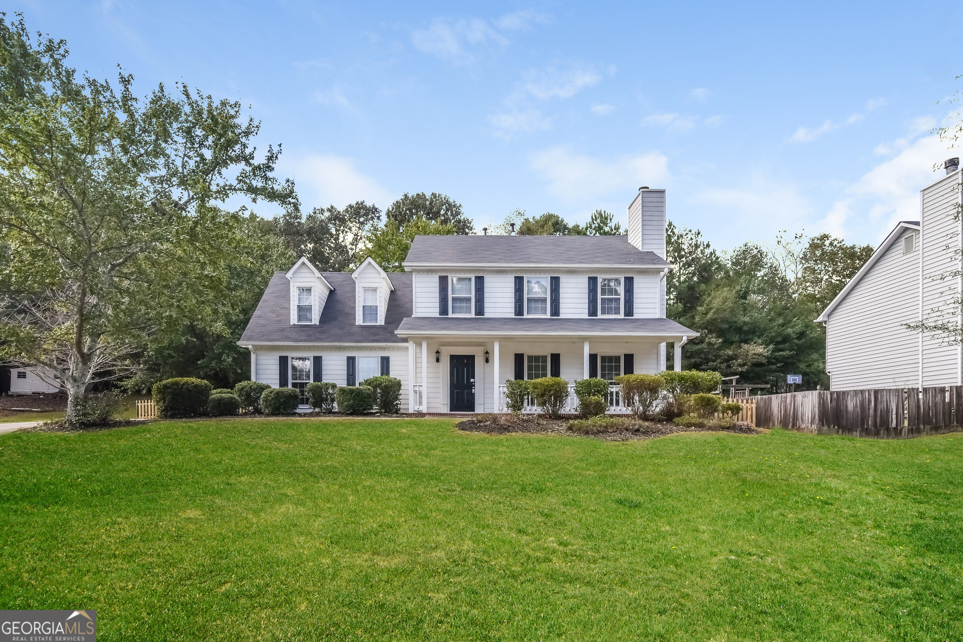 2935 Emerson Lake Drive Snellville, GA 30078 - Photo 1 of 15 a front view of a house with garden