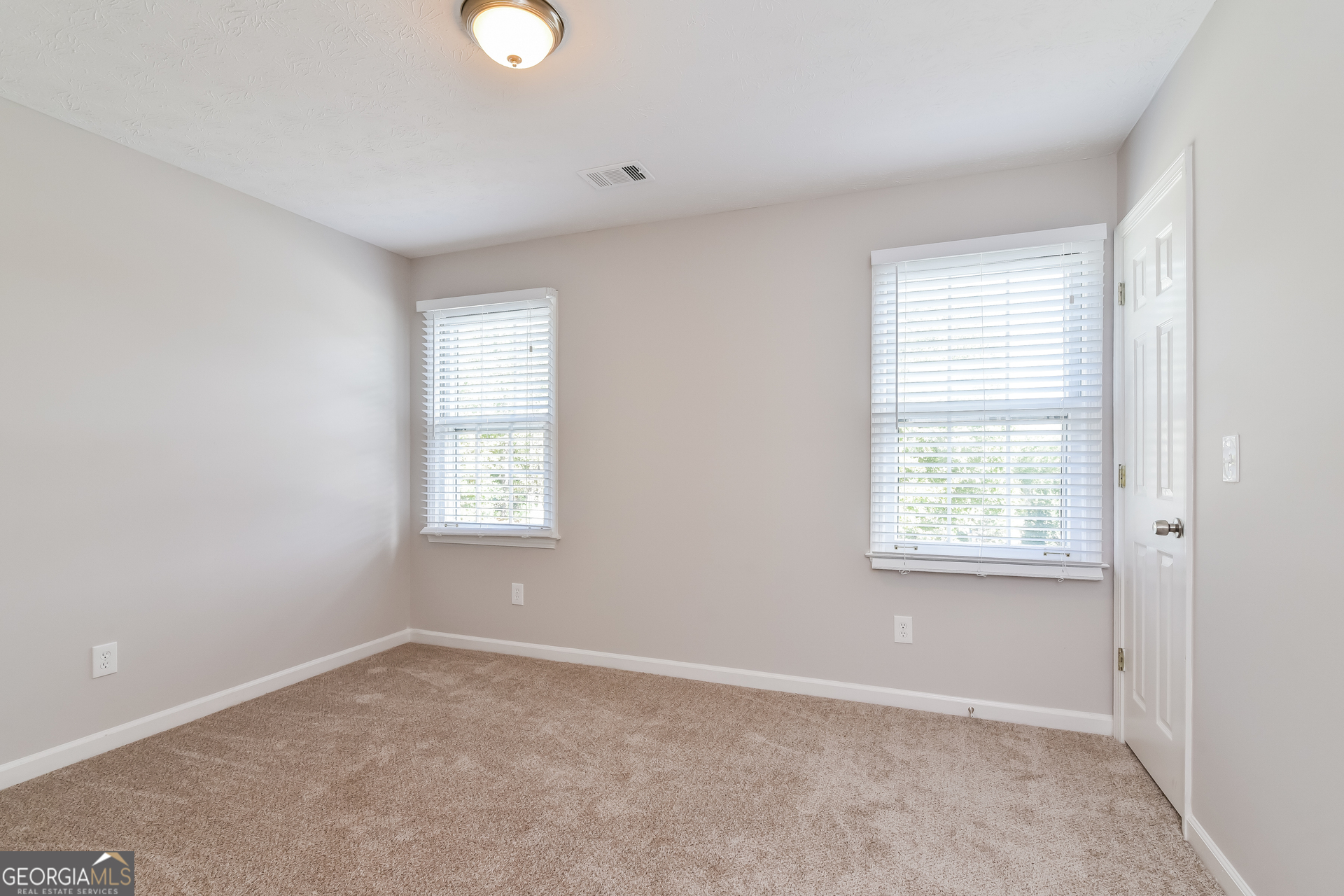 2935 Emerson Lake Drive Snellville, GA 30078 - Photo 12 of 15 a view of an empty room with a window