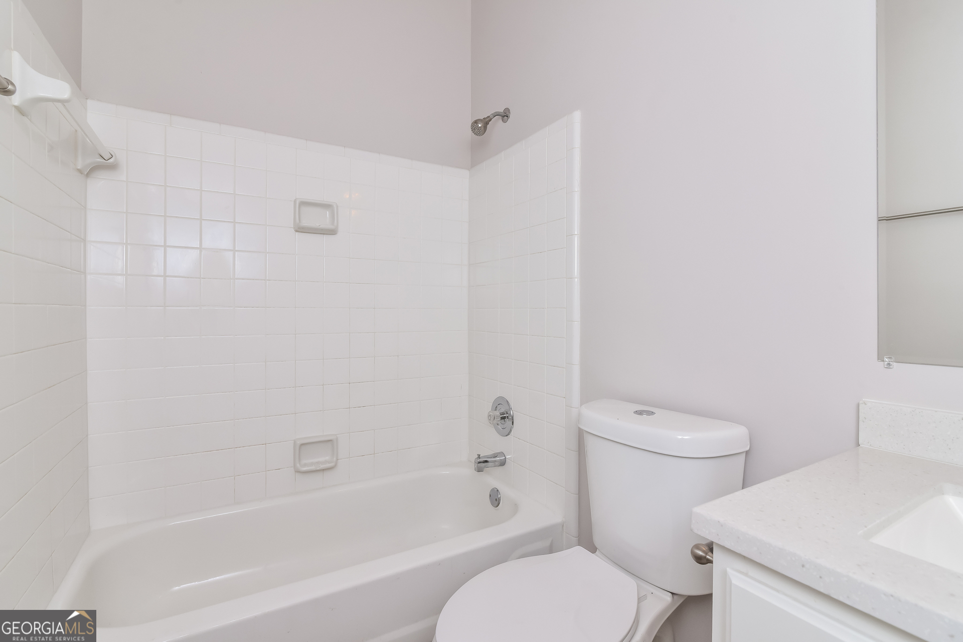 2935 Emerson Lake Drive Snellville, GA 30078 - Photo 14 of 15 a white toilet sitting next to a bath tub