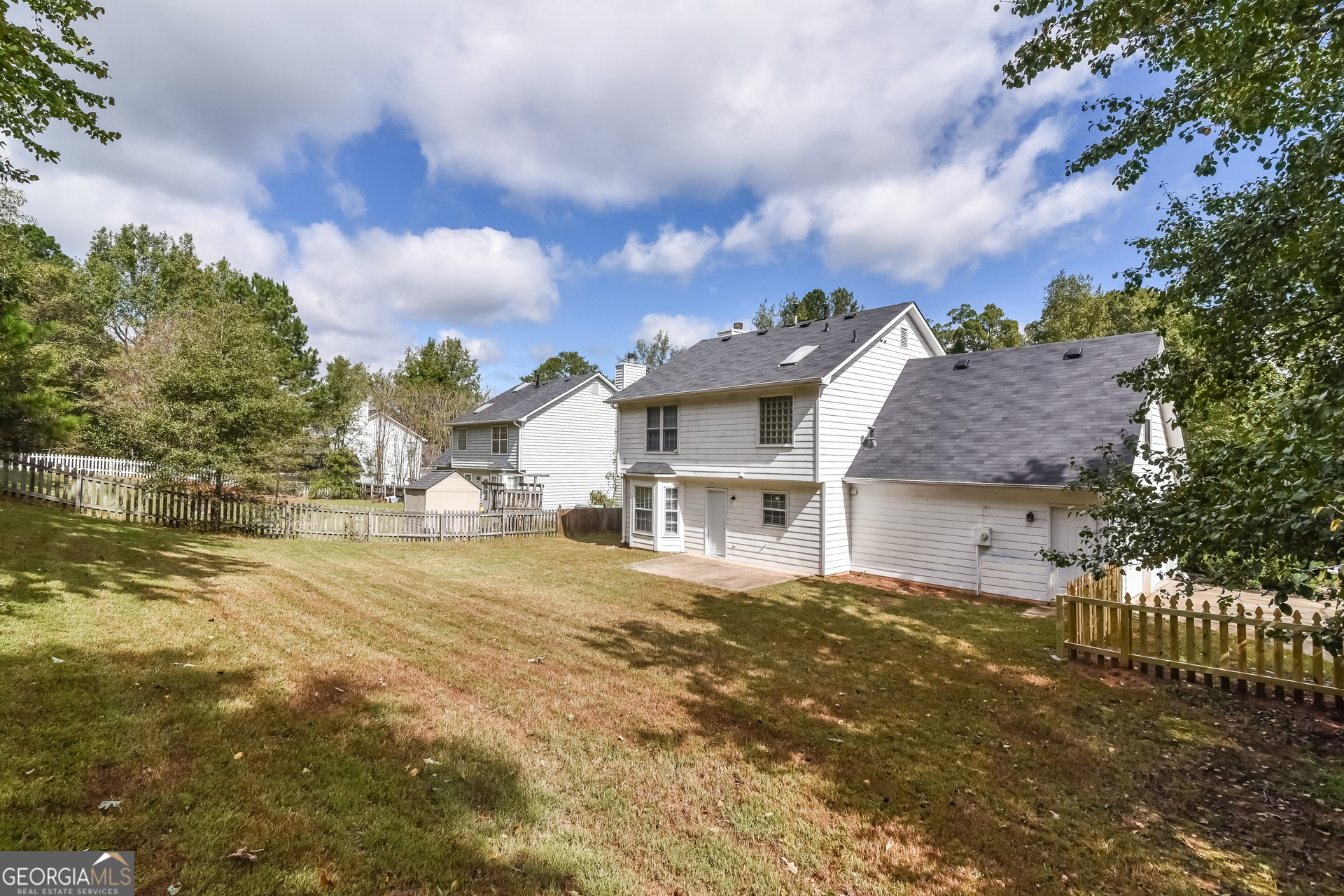 2935 Emerson Lake Drive Snellville, GA 30078 - Photo 15 of 15 a view of a house with a yard