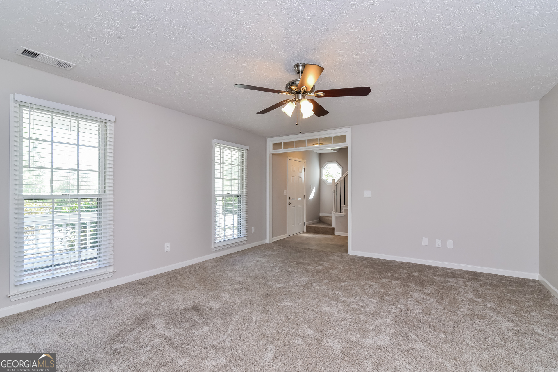 2935 Emerson Lake Drive Snellville, GA 30078 - Photo 3 of 15 wooden floor in an empty room with a window