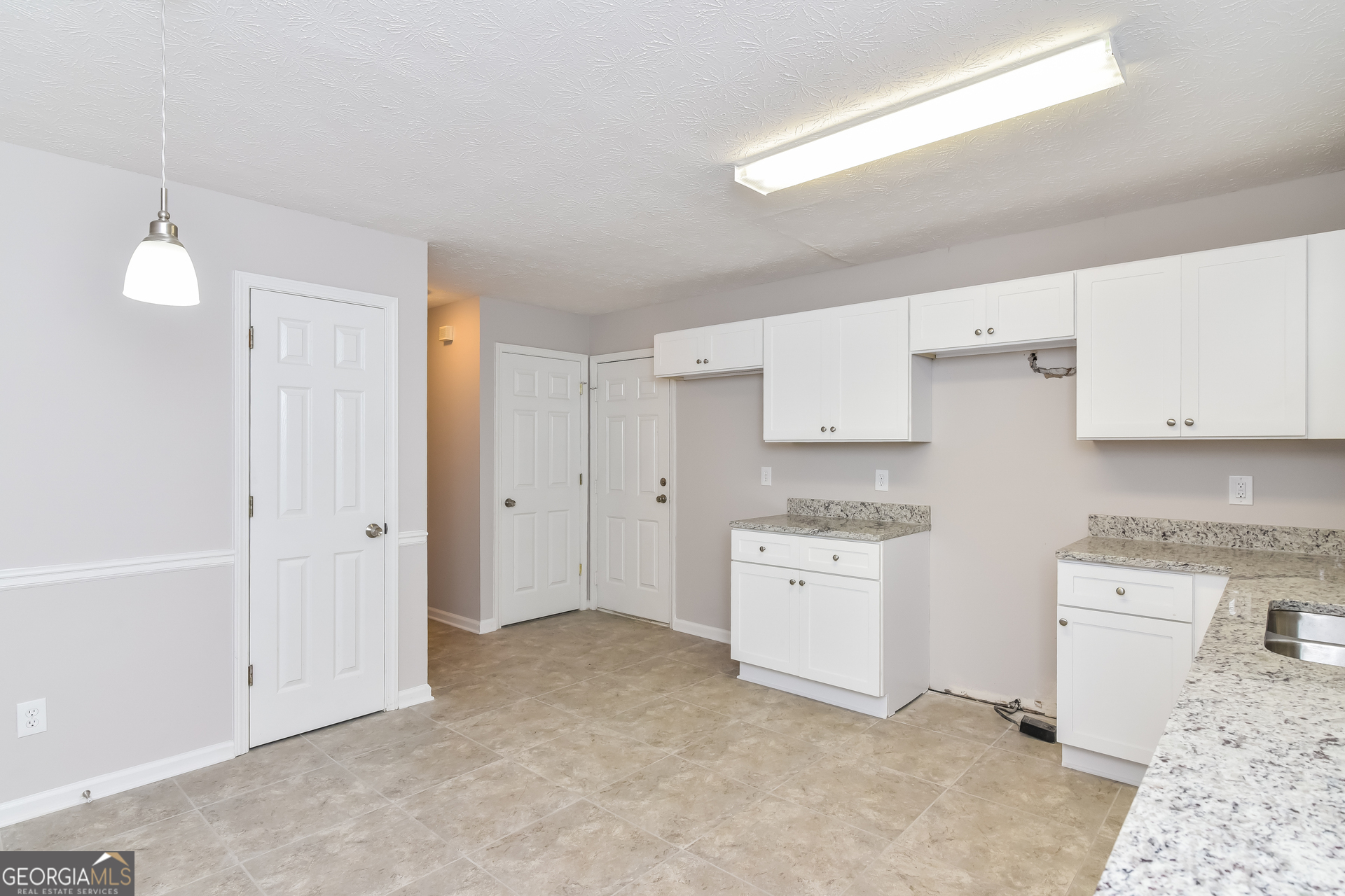 2935 Emerson Lake Drive Snellville, GA 30078 - Photo 7 of 15 a kitchen with cabinets stove top oven and sink