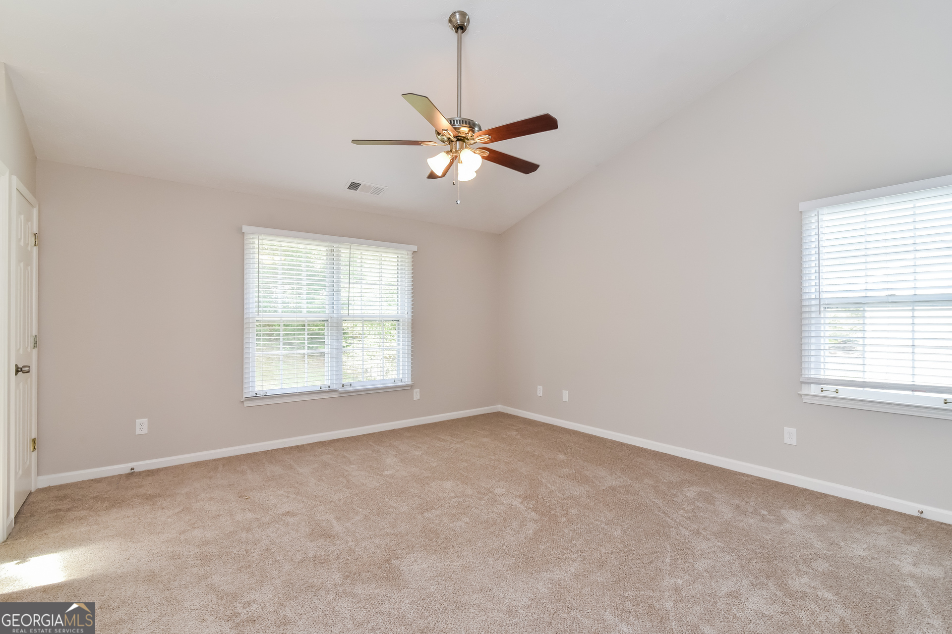 2935 Emerson Lake Drive Snellville, GA 30078 - Photo 8 of 15 a view of an empty room with a window