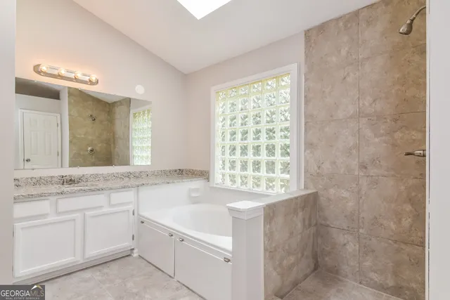 a bathroom with a sink a toilet and a bathtub