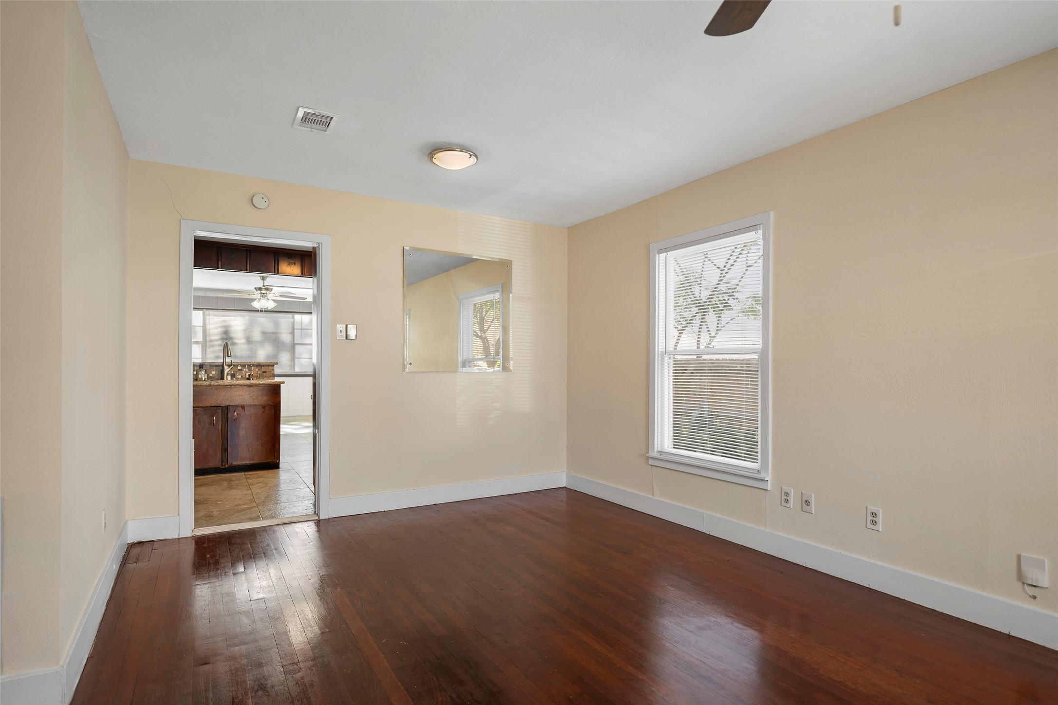 4111 Law Street West University Place, TX 77005 - Photo 11 of 29 an empty room with wooden floor and windows