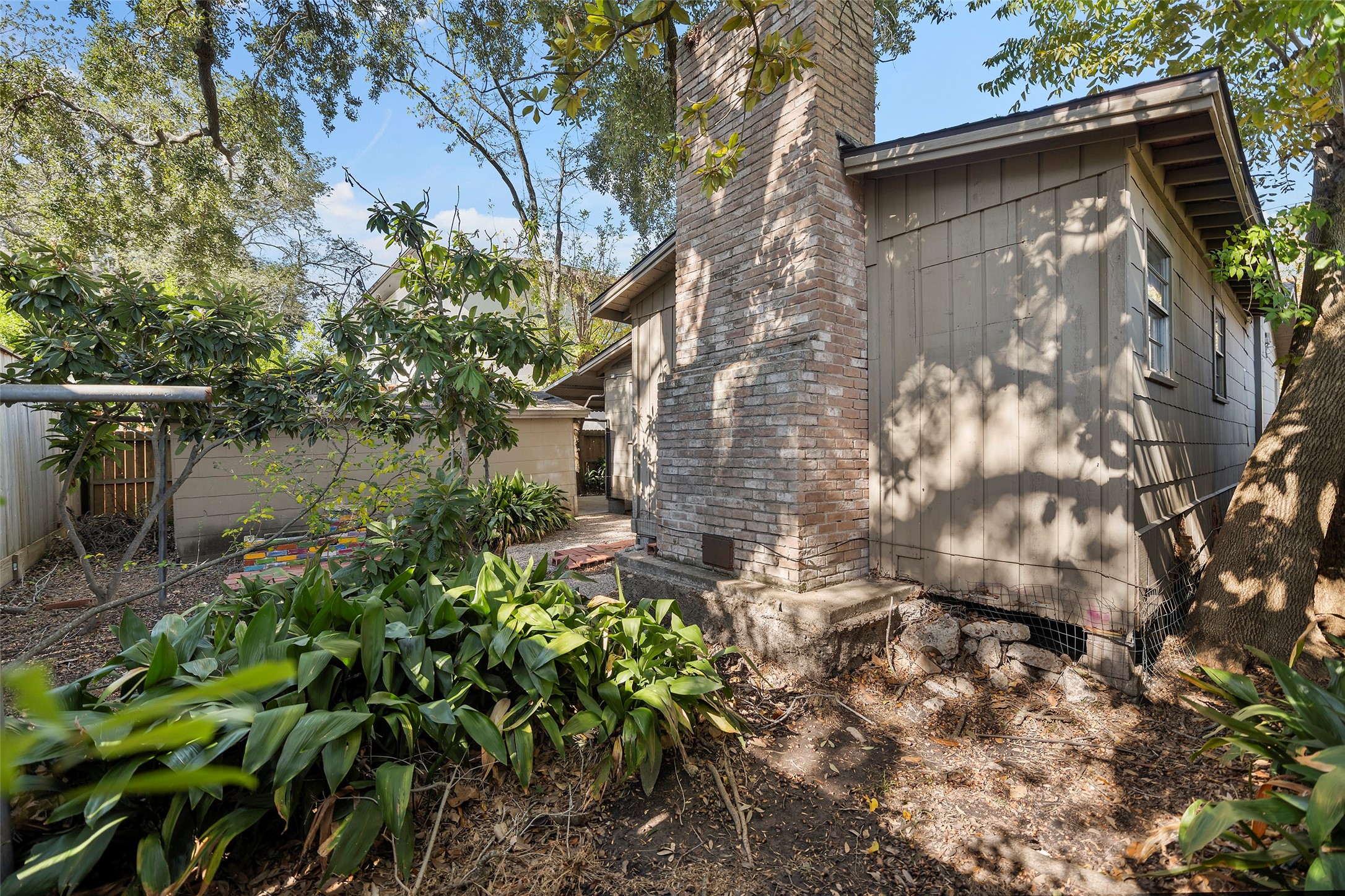 4111 Law Street West University Place, TX 77005 - Photo 22 of 29 a backyard of a house with lots of green space