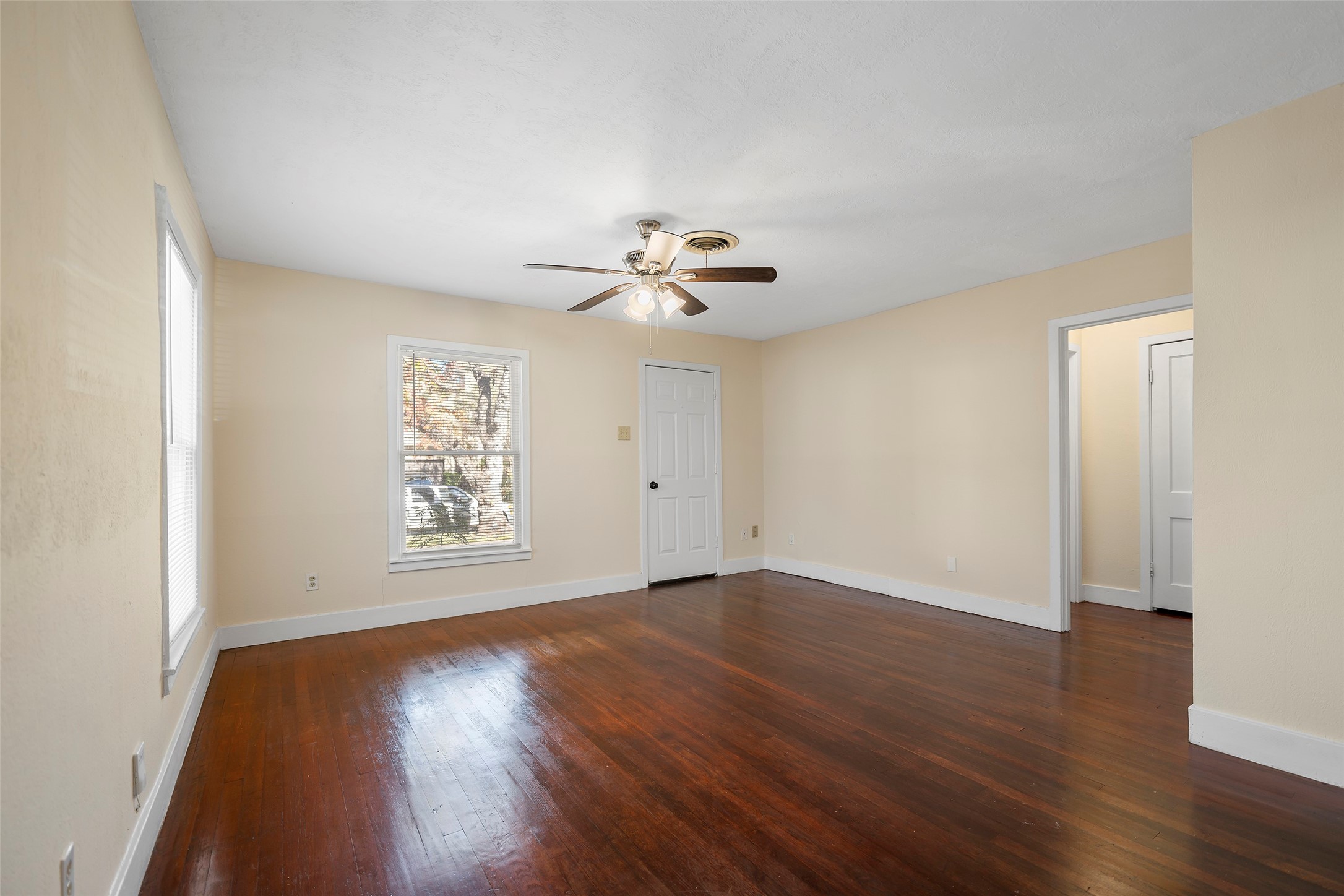 4111 Law Street West University Place, TX 77005 - Photo 3 of 29 an empty room with wooden floor and windows