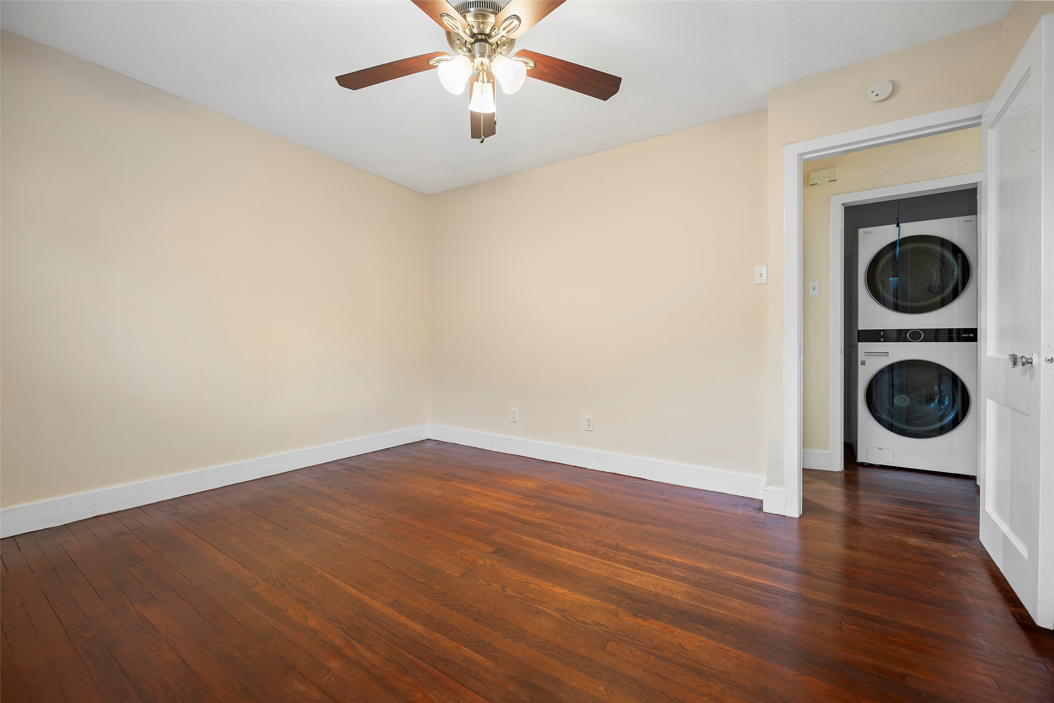 4111 Law Street West University Place, TX 77005 - Photo 5 of 29 an empty room with wooden floor and windows